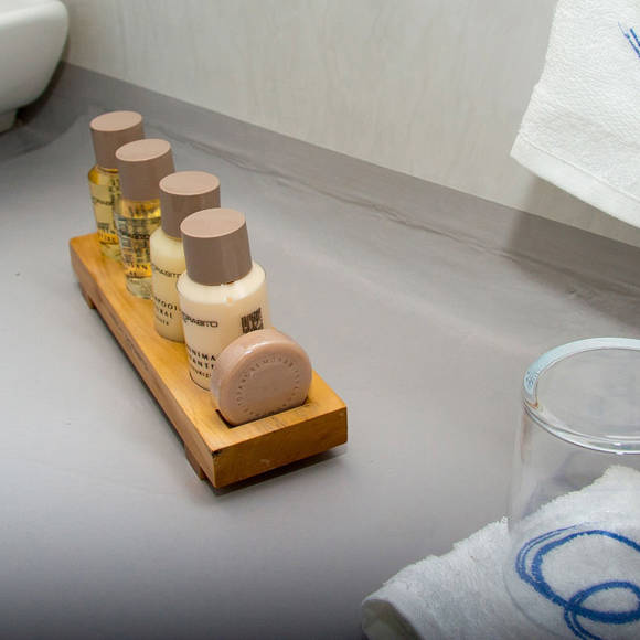 Grand Ambassador Santorini Infinity Honeymoon Cave Suite luxury amenities and embroidered linens